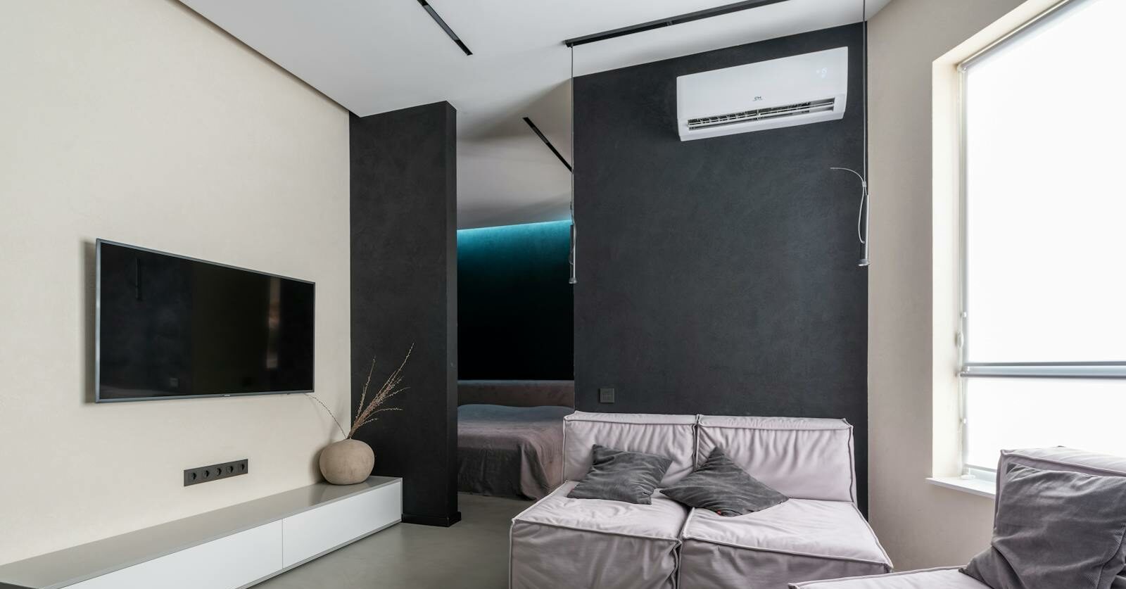 Cozy living room with sofas and TV set